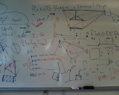 Whiteboard scribbles showing early development of the cellular approximation procedure and the classification of light rays into 1-bounce, 2-bounce, etc. families.